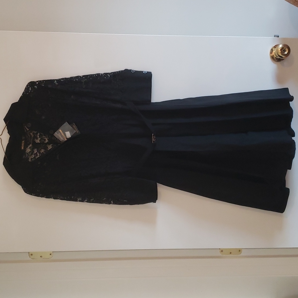Black, pleated dress with lace top and elastic belt.